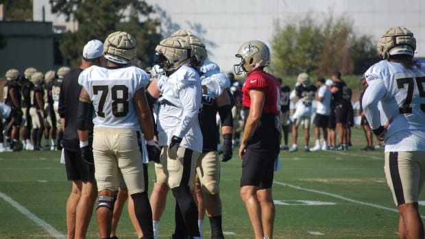 Derek Carr and the Saints offensive line at training camp practice.