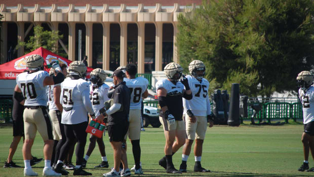 Saints offensive line at training camp on Thursday.