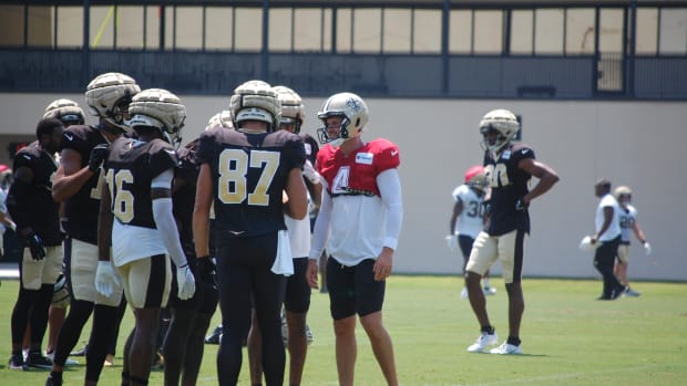 Derek Carr and the Saints skill players going through drills at training camp.