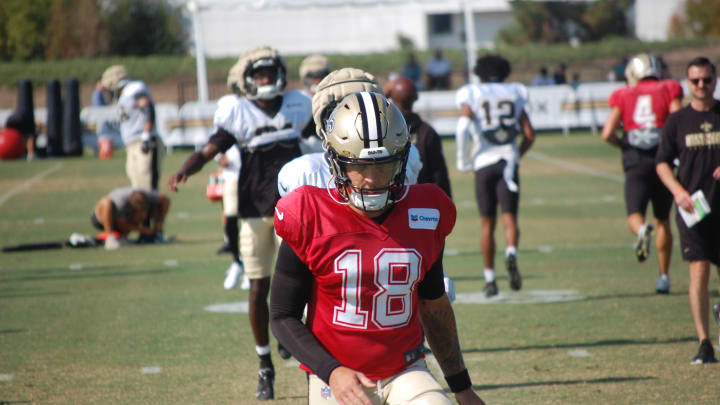 Spencer Rattler goes through stretch during Day 13 of Saints training camp.