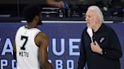 Aug 13, 2020; Lake Buena Vista, Florida, USA; Gregg Popovich of the San Antonio Spurs talks with Chimezie Metu #7 of the San Antonio Spurs on the sidelines during the first quarter against the Utah Jazz at The Field House at ESPN Wide World of Sports Complex. Mandatory Credit: Kevin C. Cox/Pool Photo-Imagn Images