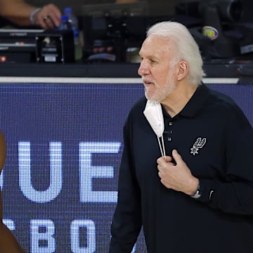 Aug 13, 2020; Lake Buena Vista, Florida, USA; Gregg Popovich of the San Antonio Spurs talks with Chimezie Metu #7 of the San Antonio Spurs on the sidelines during the first quarter against the Utah Jazz at The Field House at ESPN Wide World of Sports Complex. Mandatory Credit: Kevin C. Cox/Pool Photo-Imagn Images