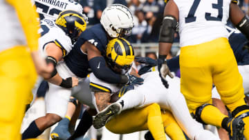 Penn State linebacker Kobe King (41) tackles Michigan running back Blake Corum 