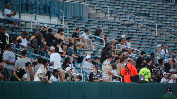 Saints fans arrive early for training camp practice at Tulane's Yulman Stadium.