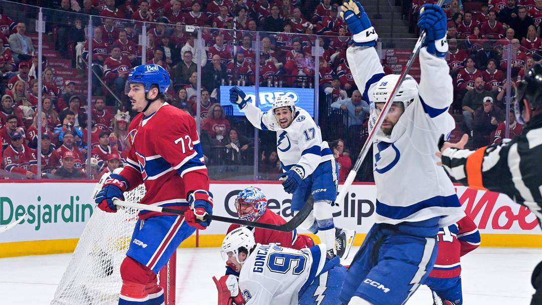 May 1, 2026; Montreal, Quebec, CAN; Tampa Bay Lightning forward Gage Goncalves (93) scores the winning  goal against Montreal Canadiens goalie Jakub Dobes (75) during the overtime period in game six of the first round of the 2026 Stanley Cup Playoffs at the Bell Centre. Mandatory Credit: Eric Bolte-Imagn Images