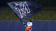 Jul 11, 2021; Miami, Florida, USA; Miami Marlins mascot Billy the Marlin waves a Miami Marlins flag after winning the game against the Atlanta Braves at loanDepot Park. Mandatory Credit: Sam Navarro-Imagn Images