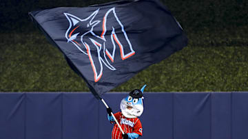 Jul 11, 2021; Miami, Florida, USA; Miami Marlins mascot Billy the Marlin waves a Miami Marlins flag after winning the game against the Atlanta Braves at loanDepot Park. Mandatory Credit: Sam Navarro-Imagn Images