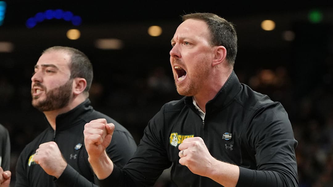 Mar 19, 2026; Greenville, SC, USA; Siena Saints head coach Gerry McNamara reacts in the first half during a first round game of the men's 2026 NCAA Tournament at Bon Secours Wellness Arena. Mandatory Credit: Bob Donnan-Imagn Images
