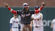 Sep 24, 2025; Cumberland, Georgia, USA; Washington Nationals shortstop CJ Abrams (5) reacts after hitting a double against the Atlanta Braves during the first inning at Truist Park. Mandatory Credit: Dale Zanine-Imagn Images