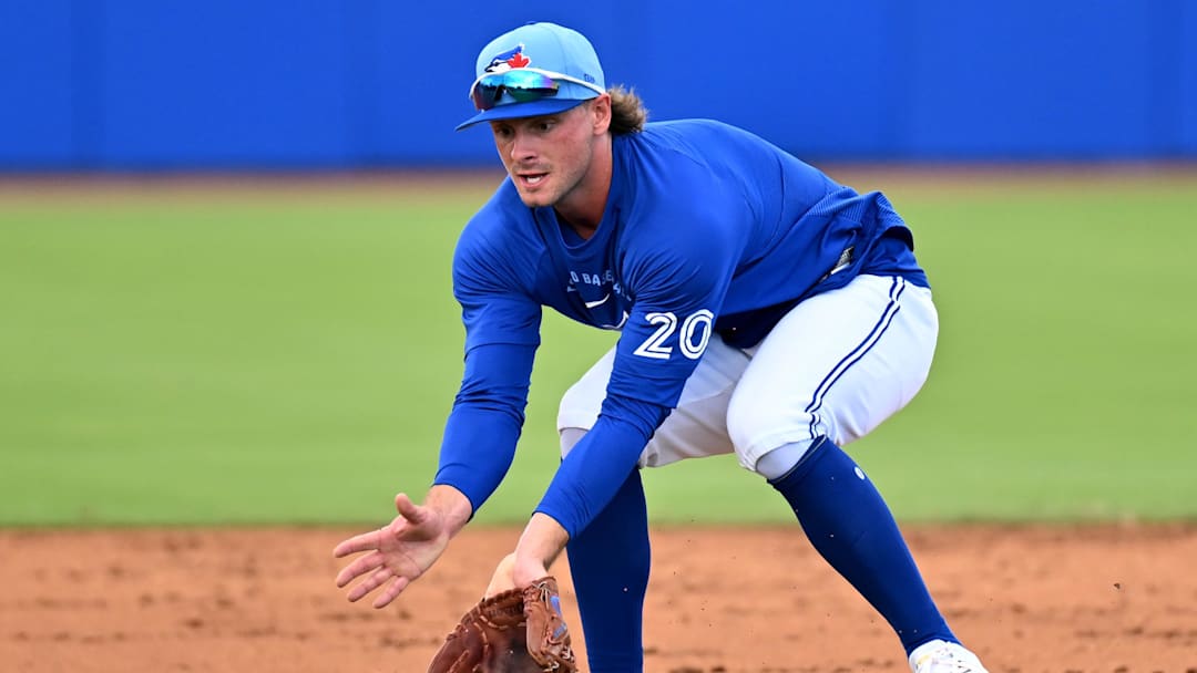 Feb 19, 2026; Dunedin, FL, USA;] Toronto Blue Jays infielder Ben Cowles (20) fields a ground ball during spring training at Bobby Mattick Training Center at Englebert Complex. Mandatory Credit: Jonathan Dyer-Imagn Images