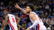 Mar 17, 2025; New Orleans, Louisiana, USA;  Detroit Pistons guard Cade Cunningham (2) reacts after a score next to center Jalen Duren (0) during the first half against the New Orleans Pelicans at Smoothie King Center. Mandatory Credit: Matthew Hinton-Imagn Images