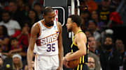 Nov 22, 2023; Phoenix, Arizona, USA; Phoenix Suns forward Kevin Durant (35) talks to Golden State Warriors guard Stephen Curry after a foul in the first half at Footprint Center. Mandatory Credit: Mark J. Rebilas-Imagn Images