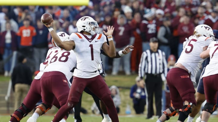 Nov 25, 2023; Charlottesville, Virginia, USA; Virginia Tech Hokies quarterback Kyron Drones (1) passes the ball against the Virginia Cavaliers during the second quarter at Scott Stadium. Mandatory Credit: Geoff Burke-USA TODAY Sports