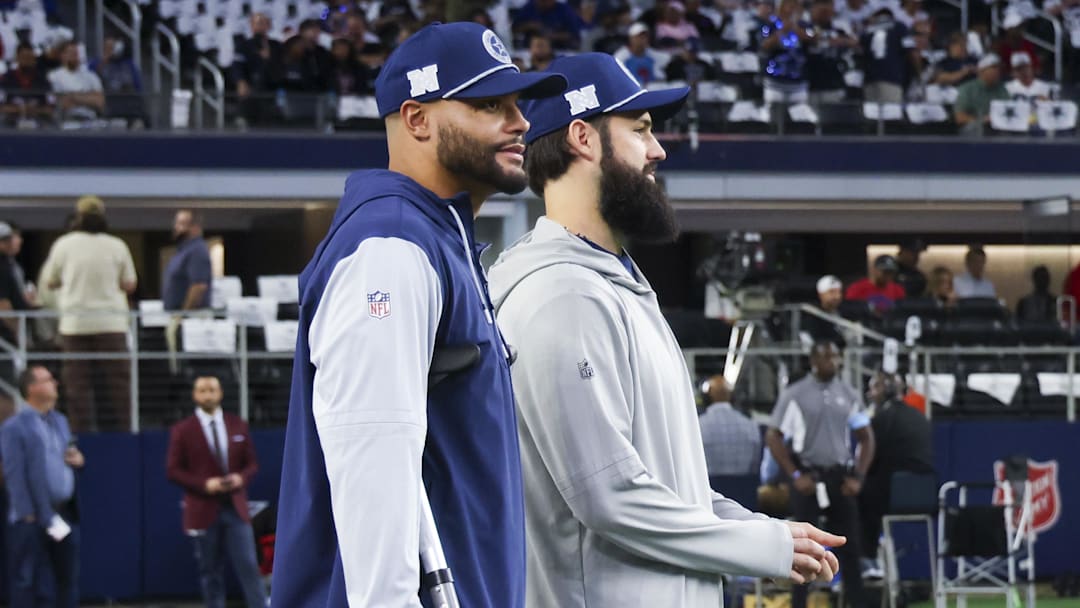 Nov 18, 2024; Arlington, Texas, USA;  Dallas Cowboys quarterback Dak Prescott (left) stands on crutches before the game against the Houston Texans at AT&T Stadium. Mandatory Credit: Kevin Jairaj-Imagn Images