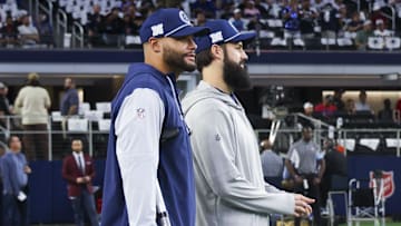 Nov 18, 2024; Arlington, Texas, USA;  Dallas Cowboys quarterback Dak Prescott (left) stands on crutches before the game against the Houston Texans at AT&T Stadium. Mandatory Credit: Kevin Jairaj-Imagn Images