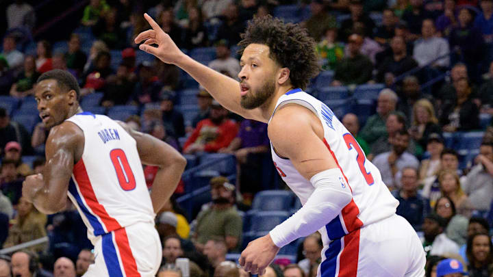 Mar 17, 2025; New Orleans, Louisiana, USA;  Detroit Pistons guard Cade Cunningham (2) reacts after a score next to center Jalen Duren (0) during the first half against the New Orleans Pelicans at Smoothie King Center. Mandatory Credit: Matthew Hinton-Imagn Images