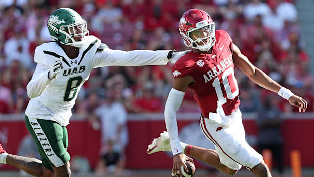 Razorbacks quarterback Taylen Green scrambles against UAB