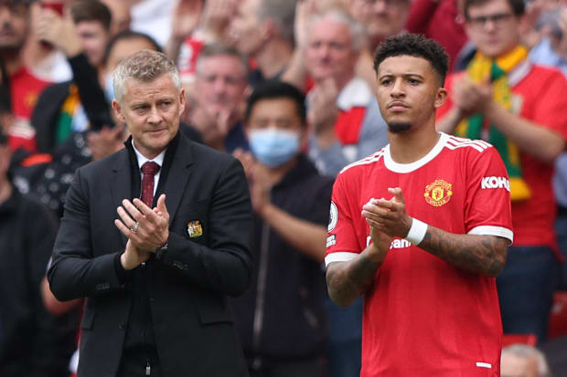 Ole Gunnar Solskjær (left) and Jadon Sancho.