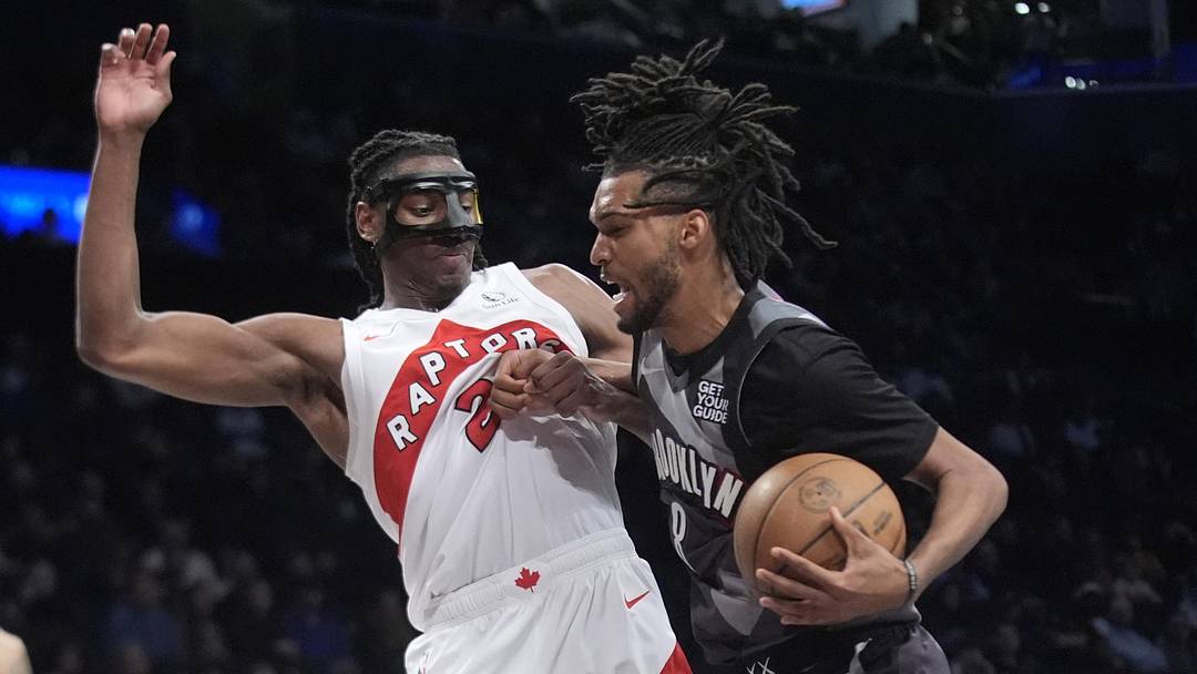 Brooklyn Nets forward Ziaire Williams drives the ball against Toronto Raptors forward Jonathan Mogbo. Brooklyn Nets forward Ziaire Williams drives the ball against Toronto Raptors forward Jonathan Mogbo.