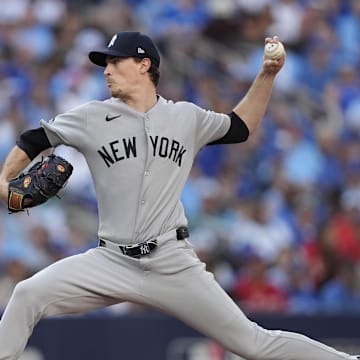 Oct 5, 2025; Toronto, Ontario, CAN; New York Yankees pitcher Max Fried (54) throws in the fourth inning against the Toronto Blue Jays during game two of the ALDS round for the 2025 MLB playoffs at Rogers Centre. Mandatory Credit: John E. Sokolowski-Imagn Images