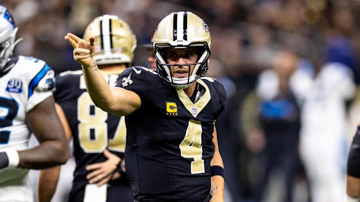 Sep 8, 2024; New Orleans, Louisiana, USA;  New Orleans Saints quarterback Derek Carr (4) reacts to rushing for a first down against the Carolina Panthers during the second half at Caesars Superdome. Mandatory Credit: Stephen Lew-Imagn Images