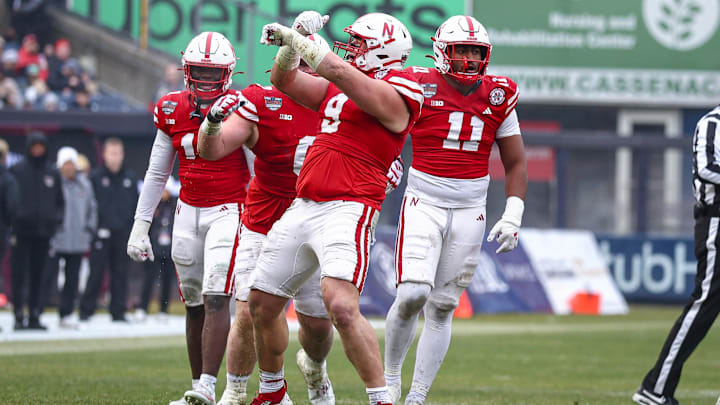 Dec 28, 2024; Bronx, NY, USA; Nebraska Cornhuskers defensive lineman Ty Robinson (9) celebrates a defensive stop during the first half against the Boston College Eagles at Yankee Stadium. Mandatory Credit: Vincent Carchietta-Imagn Images