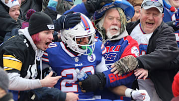 The Bills' Nyheim Hines jumps into stands after the first of his two kickoff returns for touchdowns against the Patriots.