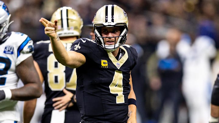 Sep 8, 2024; New Orleans, Louisiana, USA;  New Orleans Saints quarterback Derek Carr (4) reacts to rushing for a first down against the Carolina Panthers during the second half at Caesars Superdome. Mandatory Credit: Stephen Lew-Imagn Images