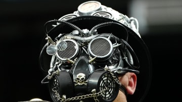 Jan 7, 2024; Paradise, Nevada, USA; A Las Vegas Raiders fan in costume watches a game between the