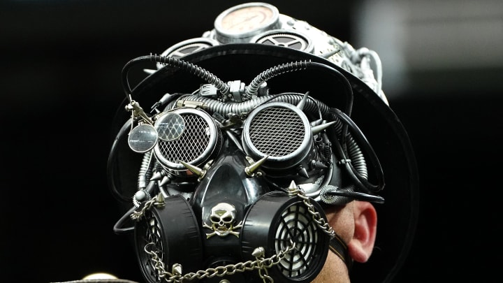 Jan 7, 2024; Paradise, Nevada, USA; A Las Vegas Raiders fan in costume watches a game between the