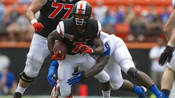 Dec 24, 2013; Honolulu, HI, USA; Oregon State Beavers wide receiver Brandin Cooks (7) runs past Boise State Broncos defensive end Demarcus Lawrence (8) during the 2nd quarter of the 2013 Hawaii Bowl at Aloha Stadium. Mandatory Credit: Marco Garcia-Imagn Images