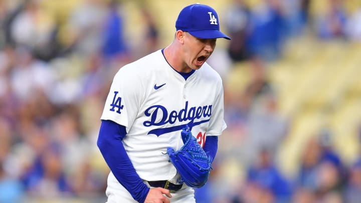 Dodgers pitcher Walker Buehler reacts following the first inning of a game against the Colorado Rockies at Dodger Stadium.