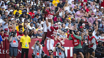 Oct 26, 2024; Tuscaloosa, Alabama, USA; Alabama Crimson Tide running back Jam Miller (26) celebrates with offensive lineman Parker Brailsford (72) after scoring a touchdown against the Missouri Tigers during the third quarter at Bryant-Denny Stadium. Mandatory Credit: Will McLelland-Imagn Images