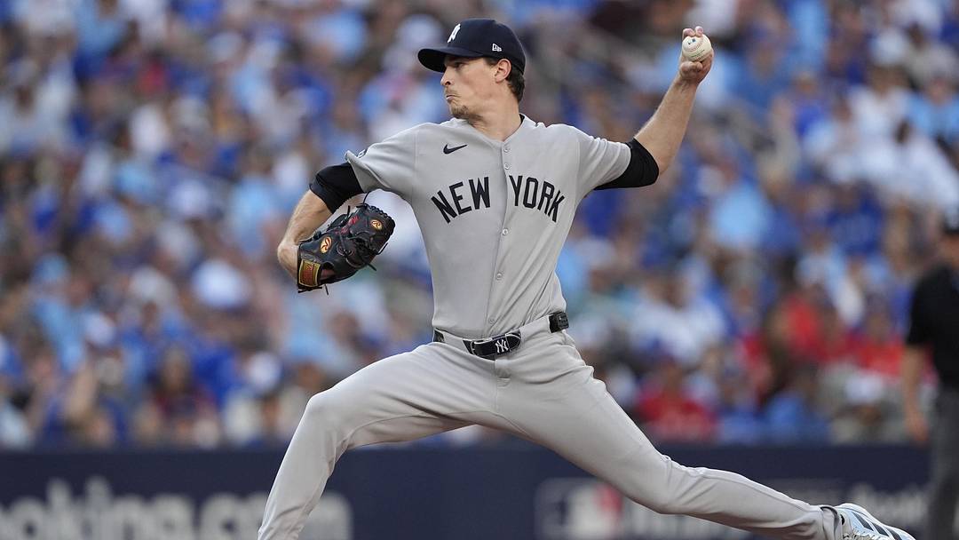 Oct 5, 2025; Toronto, Ontario, CAN; New York Yankees pitcher Max Fried (54) throws in the fourth inning against the Toronto Blue Jays during game two of the ALDS round for the 2025 MLB playoffs at Rogers Centre. Mandatory Credit: John E. Sokolowski-Imagn Images