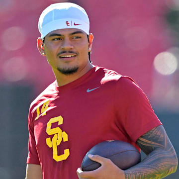Oct 11, 2025; Los Angeles, California, USA;  USC Trojans quarterback Jayden Maiava (14) warms up prior to the game against the Michigan Wolverines at United Airlines Field at the Los Angeles Memorial Coliseum. Mandatory Credit: Jayne Kamin-Oncea-Imagn Images