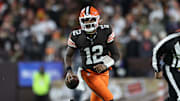 Nov 16, 2025; Cleveland, Ohio, USA; Cleveland Browns quarterback Shedeur Sanders (12) runs for a gain during the fourth quarter against the Baltimore Ravens at Huntington Bank Field. Mandatory Credit: Scott Galvin-Imagn Images