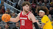 Michigan Wolverines guard Tre Donaldson (3) guards Wisconsin Badgers guard Max Klesmit (11) during the first half of the 2025 TIAA Big Ten Men’s Basketball Tournament final game on Sunday, March 16, 2025, at Gainbridge Fieldhouse in Indianapolis. Michigan defeated Wisconsin 59-53.
