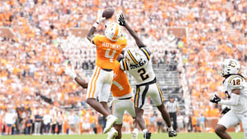 Tennessee wide receiver Mike Matthews (4) makes a catch before running into the end zone for a touchdown, while defended by ETSU defensive back Jason Duclona (2) during a college football game between Tennessee and ETSU at Neyland Stadium in Knoxville, Tennessee, on August 30, 2025.