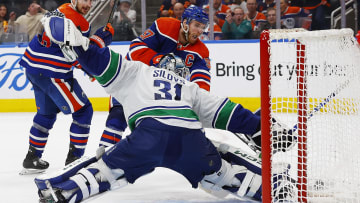 May 12, 2024; Edmonton, Alberta, CAN; Vancouver Canucks goaltender Arturs Silovs (31) makes a save on Connor McDavis (97) of Edmonton.