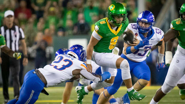 Oregon quarterback Dillon Gabriel scrambles with the ball as the Oregon Ducks host the Boise State Broncos Saturday, Sept. 7,