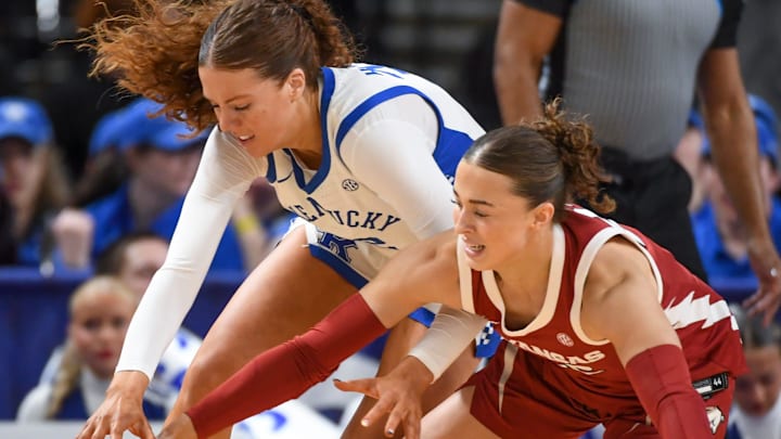 Kentucky Wildcats forward Amelia Hassett (32) and Arkansas Razorbacks guard Bonnie Deas (22) go for the ball Wednesday, March 4, 2026, during the SEC Women's Basketball Tournament first round game at Bon Secours Wellness Arena in Greenville, South Carolina.