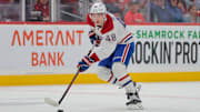 Mar 30, 2025; Sunrise, Florida, USA; Montreal Canadiens defenseman Lane Hutson (48) moves the puck against the Florida Panthers during the first period at Amerant Bank Arena. Mandatory Credit: Sam Navarro-Imagn Images