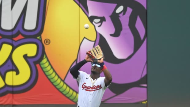 Angel Martinez catches a fly ball in center field 