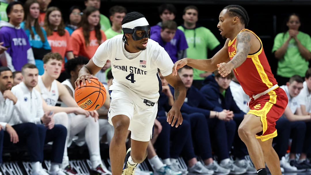 Penn State Nittany Lions guard Kayden Mingo (4) moves with the ball as USC Trojans guard Jordan Marsh (7) defends during the second half at Bryce Jordan Center.