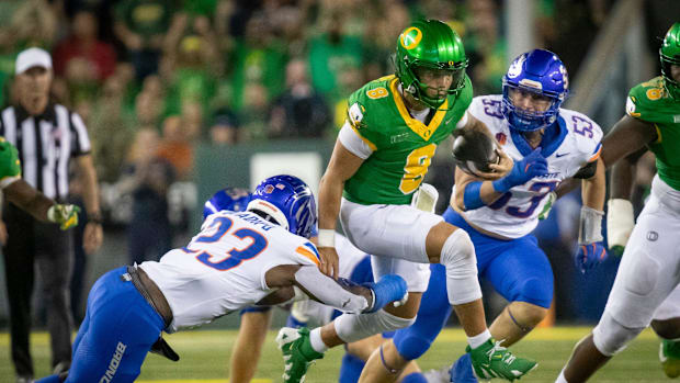 Oregon quarterback Dillon Gabriel scrambles with the ball as the Oregon Ducks host the Boise State Broncos Saturday, Sept. 7,