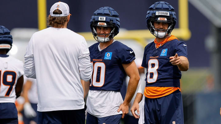 Jul 26, 2024; Englewood, CO, USA; Denver Broncos quarterback Jarrett Stidham (8) and quarterback Bo Nix (10) and quarterback Zach Wilson (4) during training camp at Broncos Park Powered by CommonSpirit. 