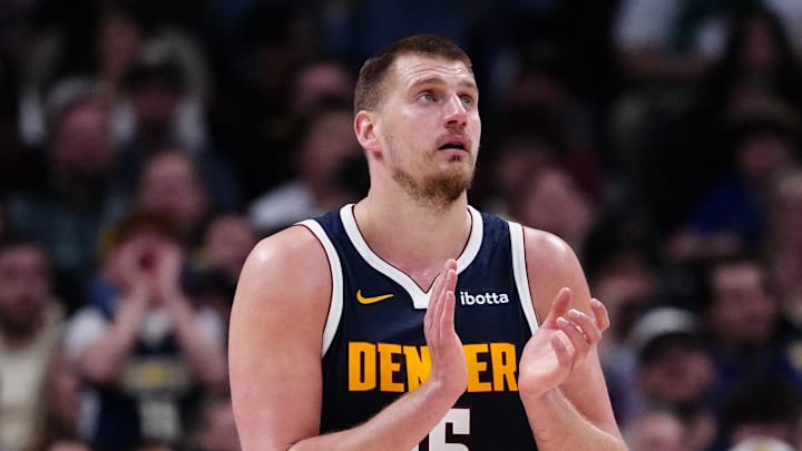 Mar 28, 2025; Denver, Colorado, USA; Denver Nuggets center Nikola Jokic (15) reacts in the third quarter against the Utah Jazz at Ball Arena. Mandatory Credit: Ron Chenoy-Imagn Images