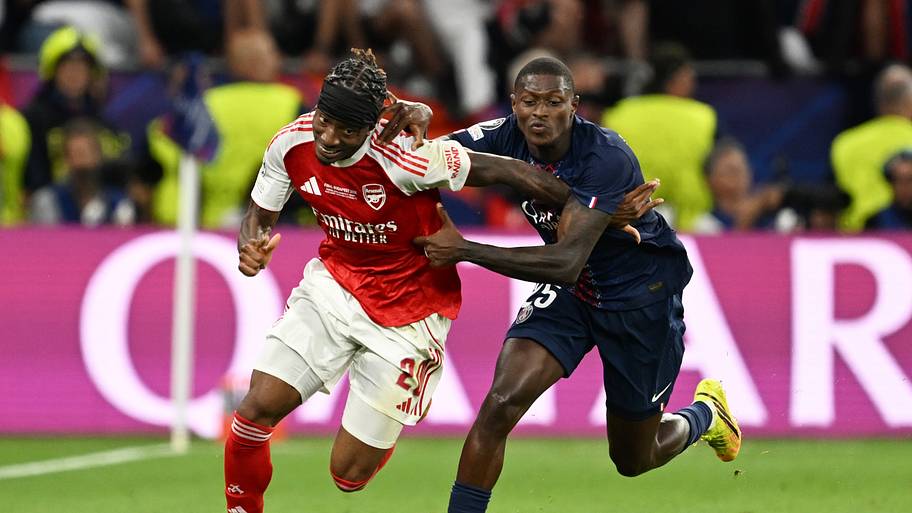 Noni Madueke (left) and Nuno Mendes battling.