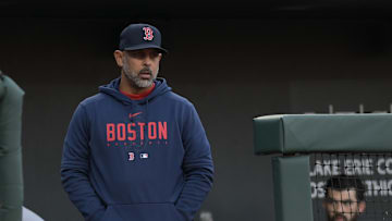 Apr 24, 2023; Baltimore, Maryland, USA;  Boston Red Sox manager Alex Cora (13) stands in the dugout during the game against the Baltimore Orioles at Oriole Park at Camden Yards. Mandatory Credit: Tommy Gilligan-Imagn Images