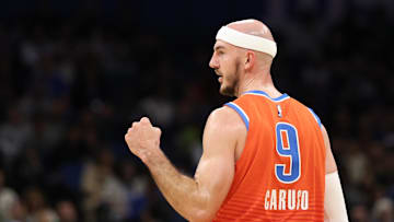 Dec 19, 2024; Orlando, Florida, USA; Oklahoma City Thunder guard Alex Caruso (9) reacts after a play against the Orlando Magic in the second quarter at Kia Center. Mandatory Credit: Nathan Ray Seebeck-Imagn Images